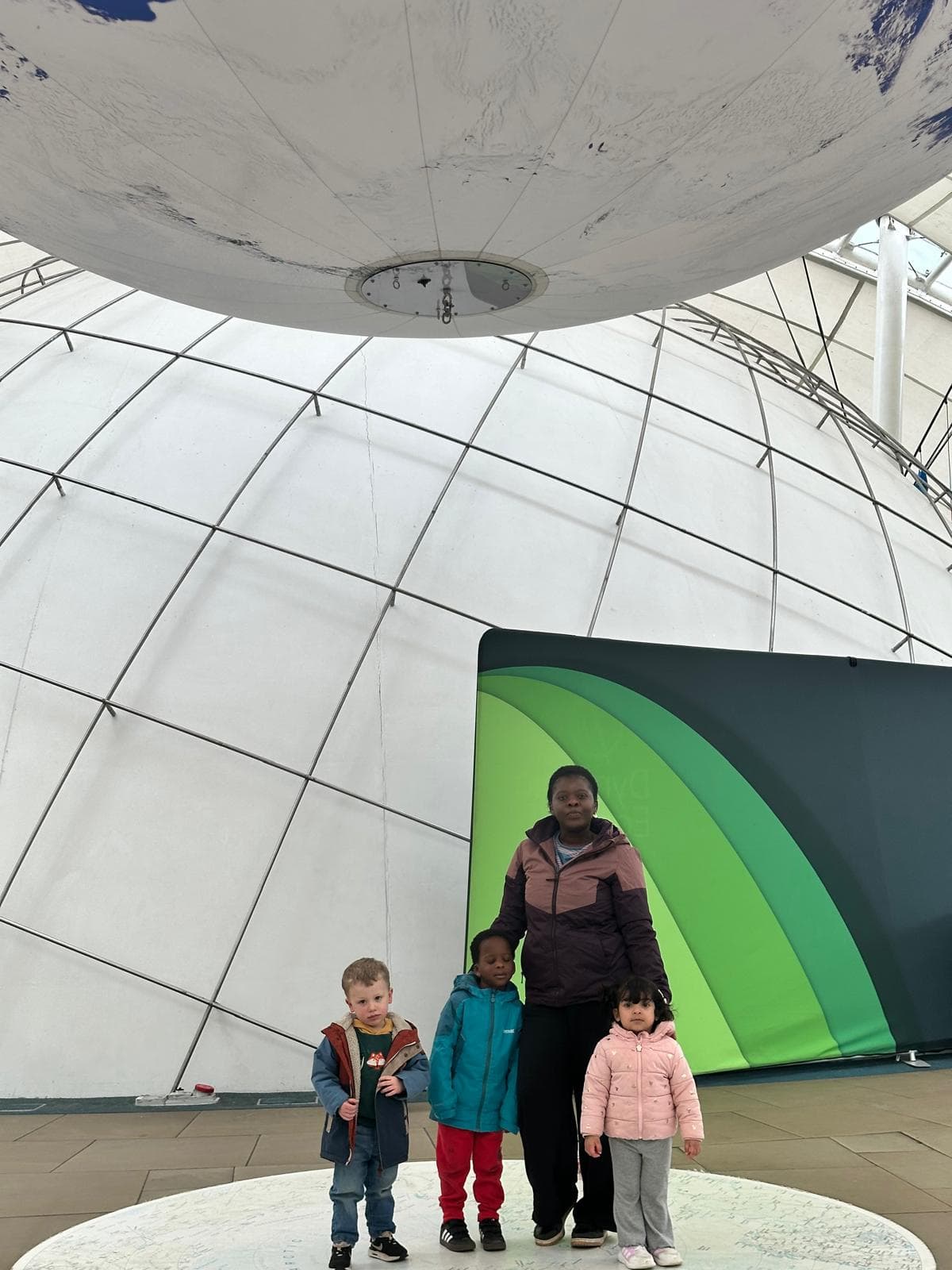 Children looking at a dinosaur skeleton in a museum